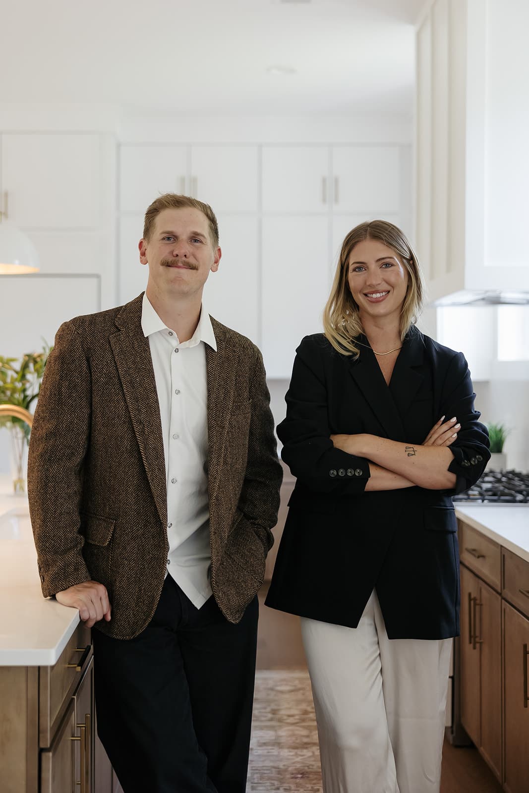 Ryan and Cassie Boggs standing together in a bright kitchen